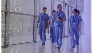 Group of healthcare workers waking down the hospital hall